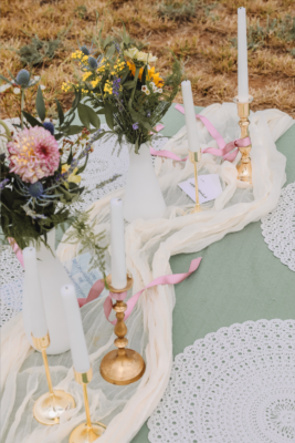 A beautifully set table in the Shenandoah Valley, featuring a vibrant floral centerpiece in a vase, elegant tableware, and a warm, inviting atmosphere.
